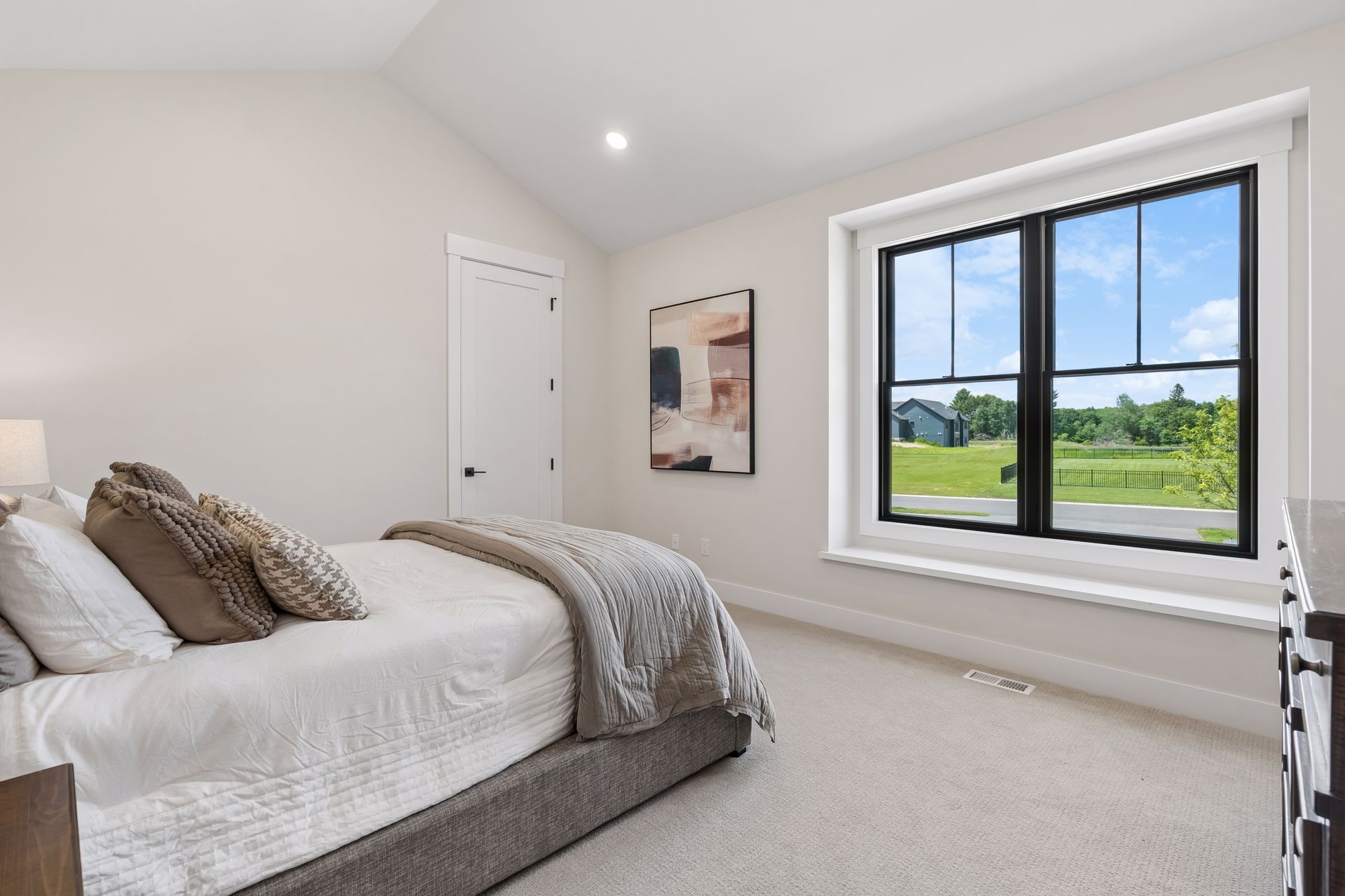 Secondary bedroom with large window, natural light and designer finishes